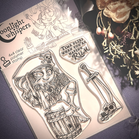This is a clear stamp of a cute and strong pirate lady holding a glass of grog and sitting on a barrel. A second stamp is of a sword stuck into a skull and a sentiment also accompanies it staying "Time Flies when you're having rum"