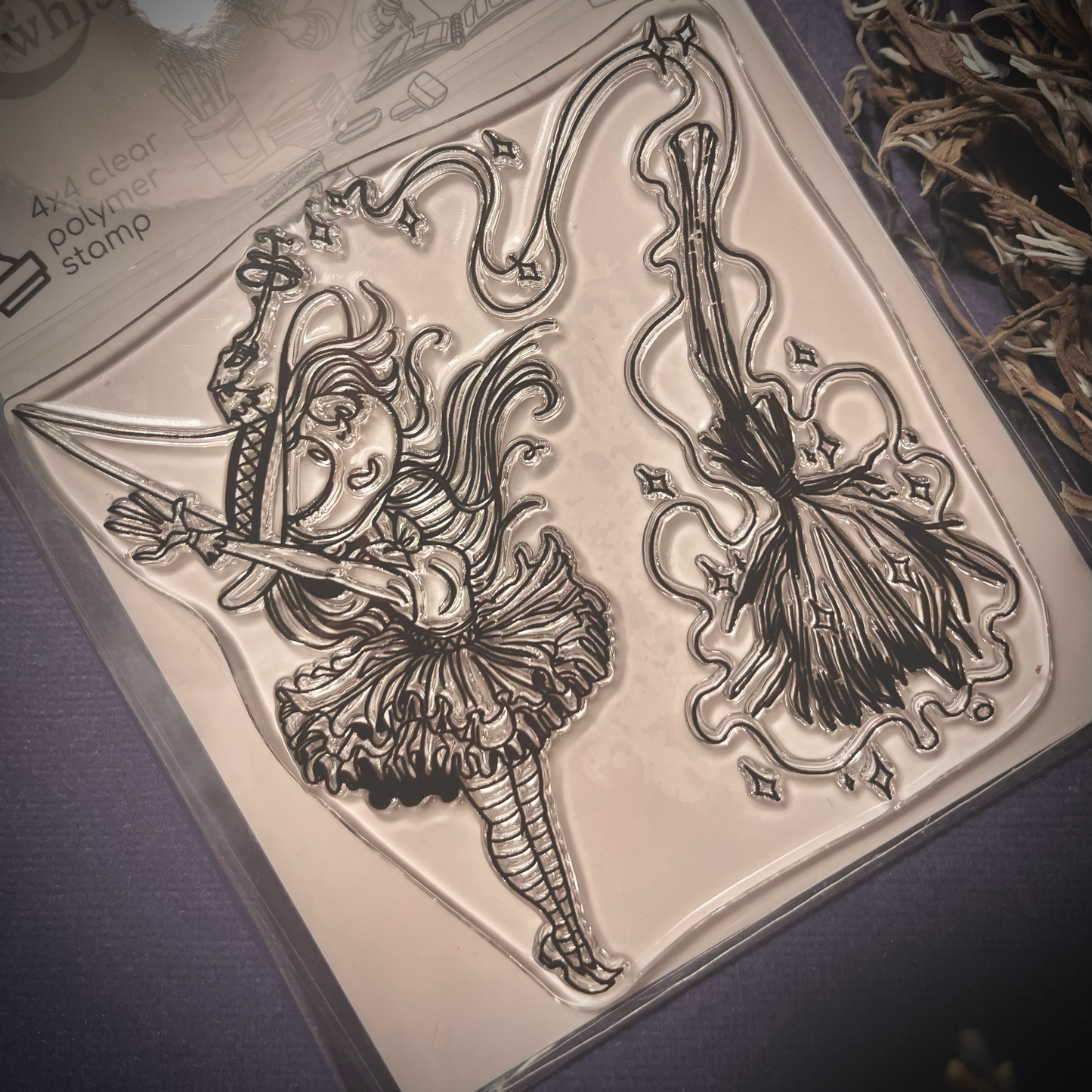 Clear stamp of a cute witch building a magic spell on her broom to ride for Halloween.