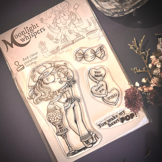 Bubblegum Bambi is a clear stamp of a cute girl standing next to a gumball machine. This clear stamp is from Moonlight Whispers and comes with sentiments and candy stamps.